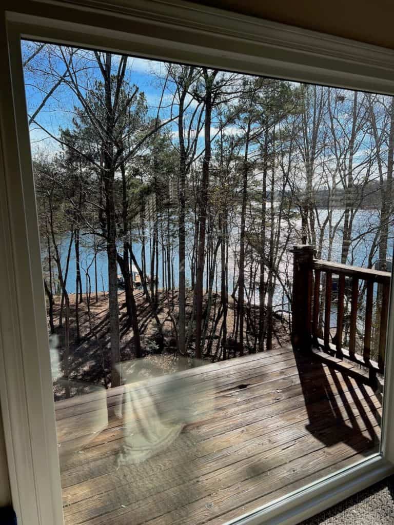 Picture Window in Master Bedroom During Winter for Expansive Lake View