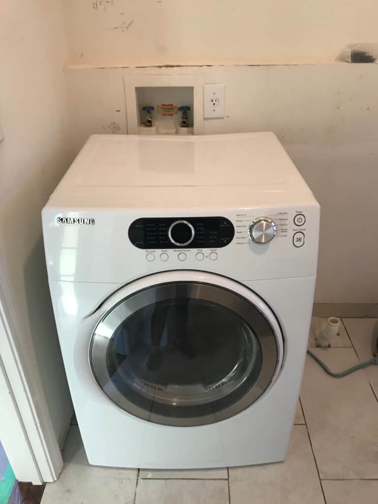 Washing machine minus pedestals showing the valves-ugly