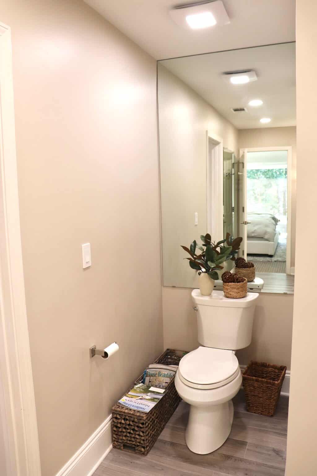 Mirror Behind Toilet in Master Bathroom adds Space to the Master Bathroom