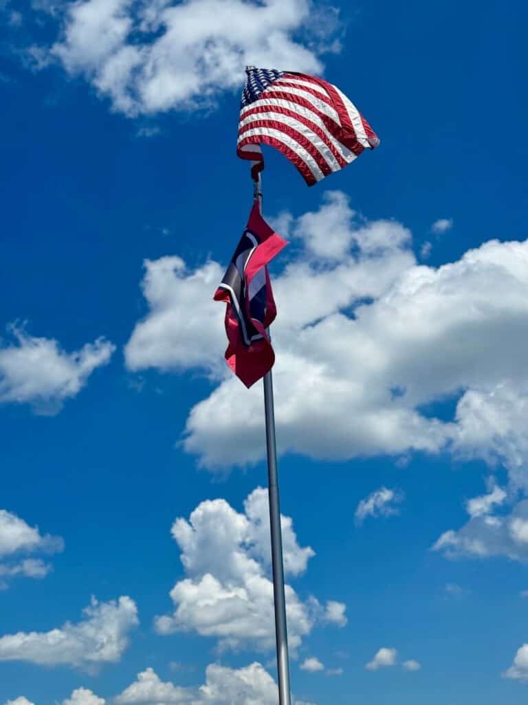 flags flying on the dock