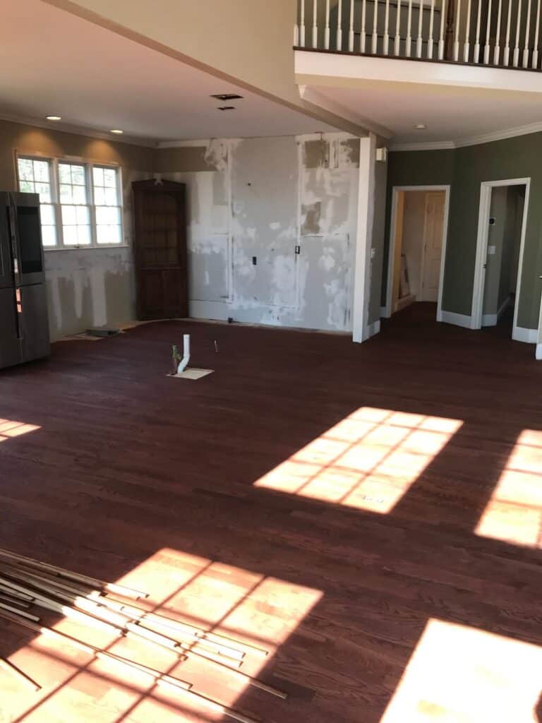Newly stained hardwood floors as seen from the outside