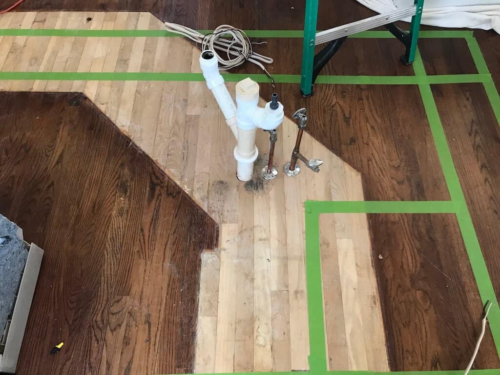 Revealing challenge 1, are hardwood floors extended under the cabinetry?