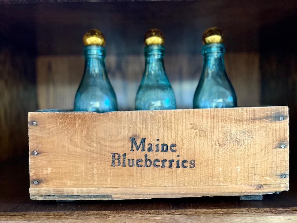 Maine Box with Milk bottles and gold ornaments